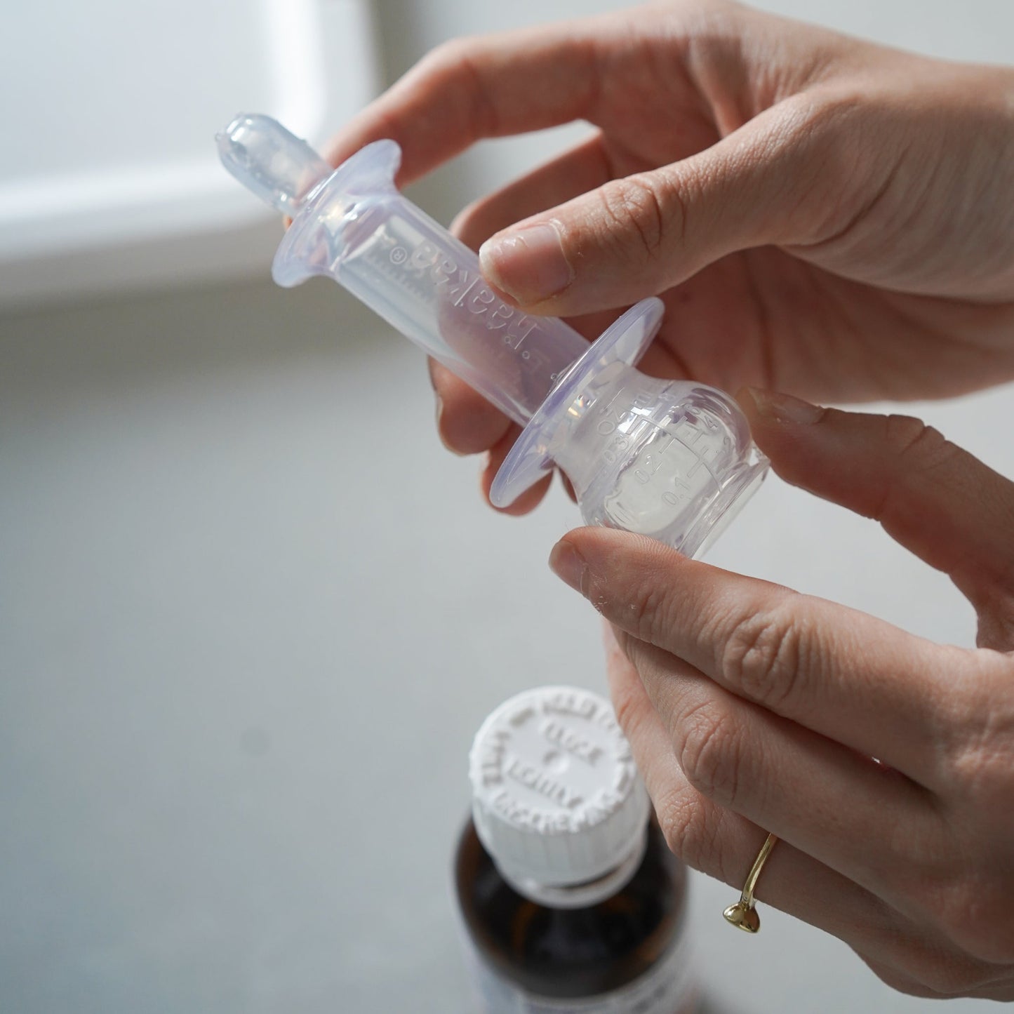 Haakaa SqueezieDOSE Silicone Dispenser 1 pk - Hello Baby Apparel