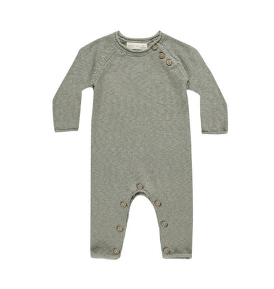 Cozy Heathered Knit Jumpsuit made of soft sweater knit. Featuring coconut buttons at the neck and along the inseam for easy changing.  Featuring our 'heathered basil' colorway.  Care: Machine wash cold. Tumble dry low.  Made of 94% Organic Cotton, 6% Linen